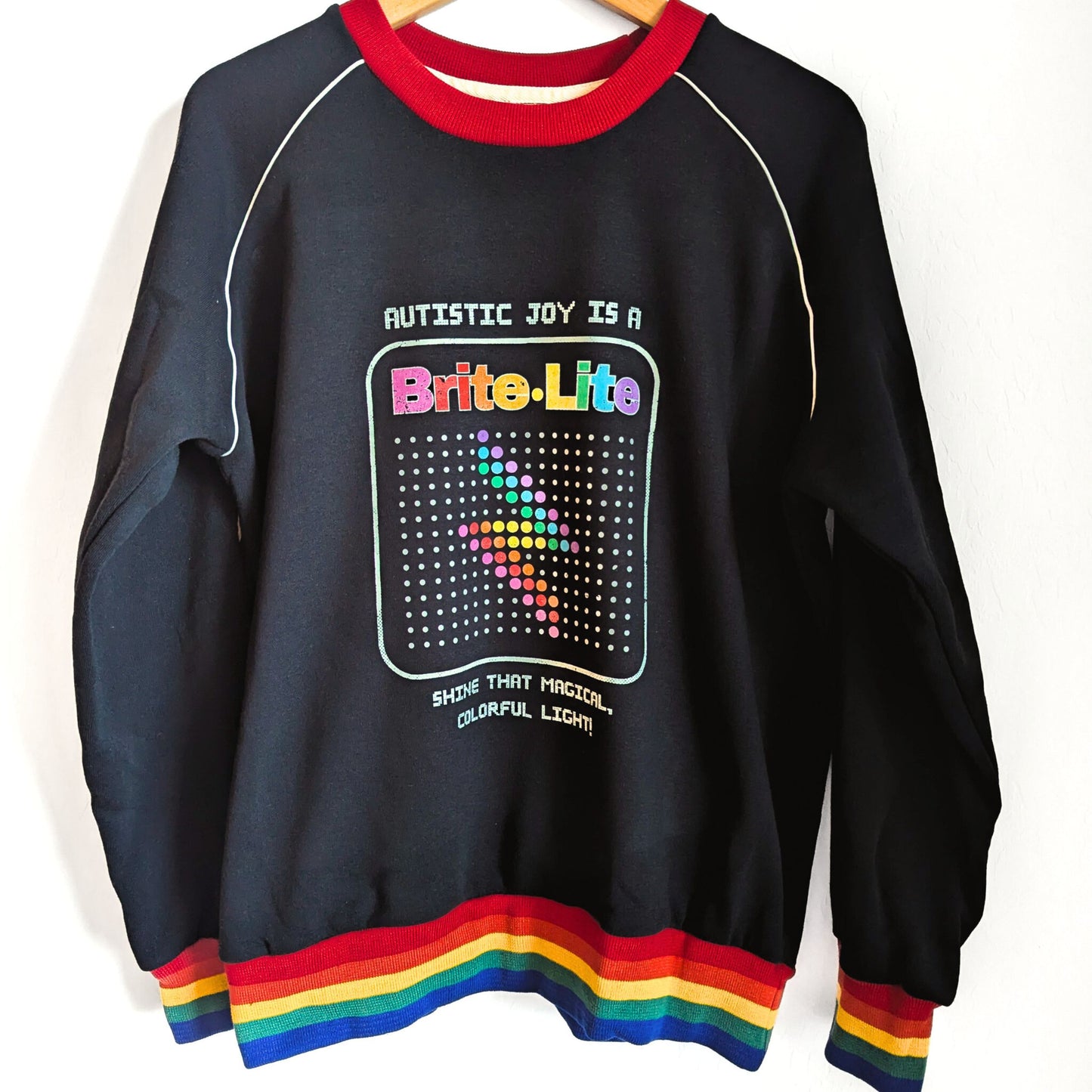 Autistic Joy is a Brite Lite - Shine that Magical Colorful Light - Adult Unisex Ribbed Rainbow Sweatshirt