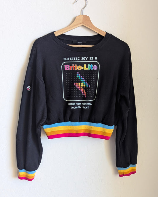 Autism is a Brite Lite - Women's Rainbow Ribbed Cropped Sweatshirt (M) - Repurposed Rebels