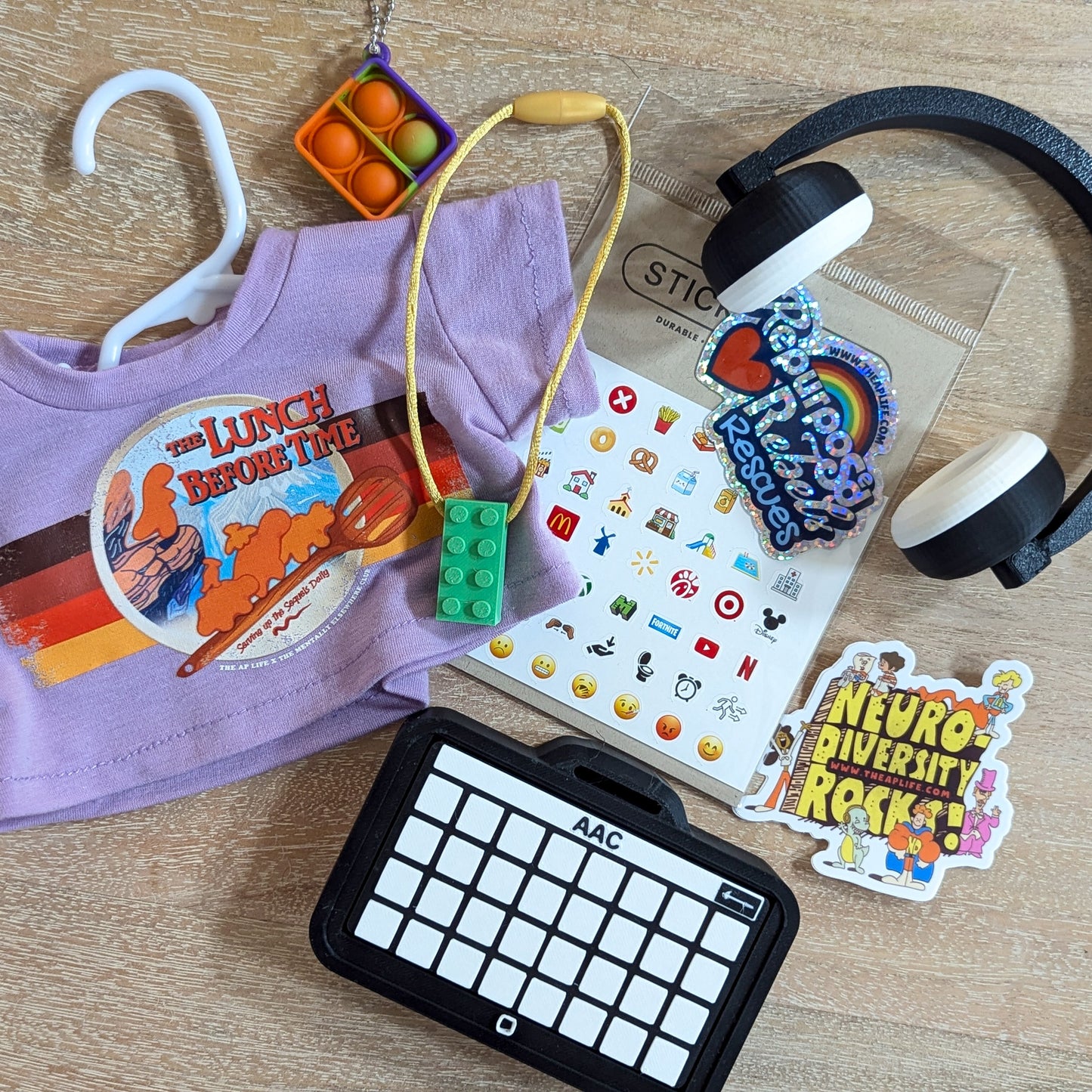Adopt T-Rex - Includes Clacky AAC with Button Stickers,  2 Advocacy Tees, Shoes, Headphones & Fidgets - RR Rescues